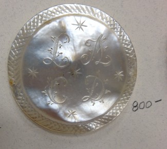 LACD translates to "she has given in" 18th century mens coat button Courtesy:Gary Brockman