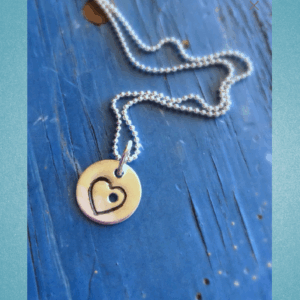 charmholeheartnecklae.jpg.