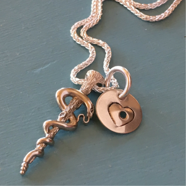 For Katie from Devin – The cadaceus pendant was created by Pat Burt from her mothers wedding ring.