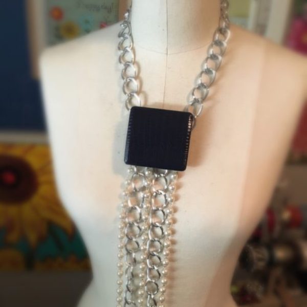 One-of-a-kind silver and blue sparkle body necklace was inspired by the Dallas Cowboys.